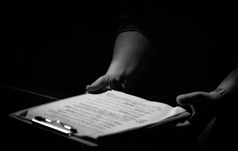 a man holding paper for his lifting operations advisory service